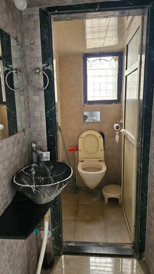 Bathroom in 3 BHK Apartment at Satya Vandan CHS, Kailash Nagar – for Rent