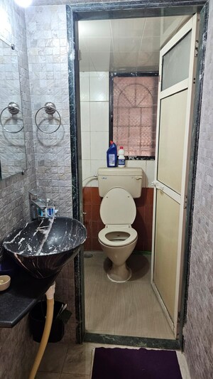 Bathroom in 3 BHK Apartment at Satya Vandan CHS, Kailash Nagar – for Rent