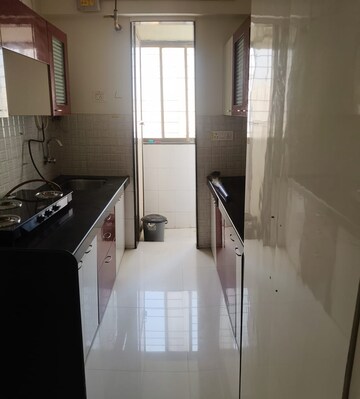 Kitchen in 1 BHK Apartment at Cosmos Orchid, Ghodbunder Road – for Rent
