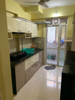 Kitchen in 2 BHK Apartment at Hiranandani Meadows, Manpada – for Rent