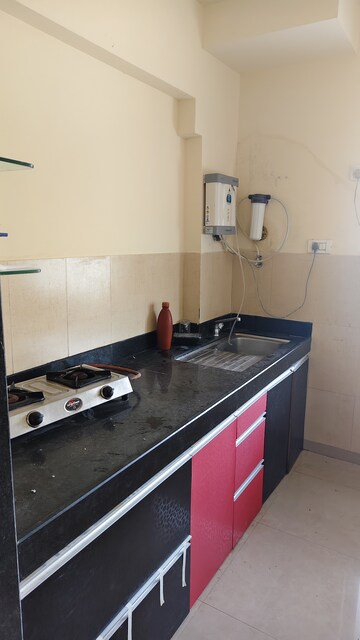 Kitchen in 1 BHK Apartment at Kalpataru Hills, Manpada – for Rent