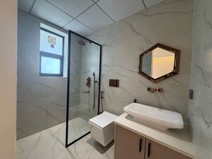 Bathroom in 3 BHK Apartment at Hermitage Royale, High Ground – for Sale