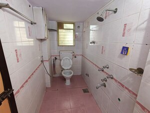 Bathroom in 2 BHK Apartment at Vasant Vihar – for Rent