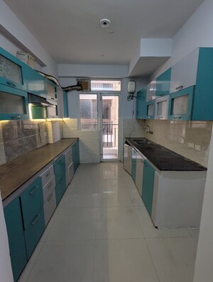 Kitchen in 3 BHK Apartment at ATS Happy Trails, Sector 10 Greater Noida – for Rent