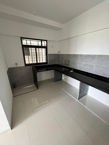 Kitchen in 2 BHK Apartment at Roshan Milestone, Tathawade – for Rent