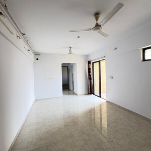 Living Room in 1 BHK Apartment at Lodha Palava City Lakeshore Greens, Hedutane – for Sale