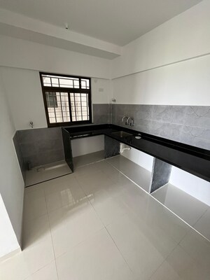 Kitchen in 2 BHK Apartment at Roshan Milestone, Tathawade – for Rent