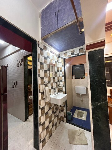 Kitchen in 1 BHK Apartment at Yashraj Park CHS, Kasarvadavali – for Sale