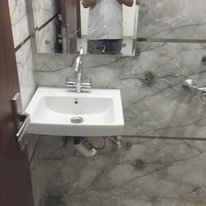 Bathroom in 2 BHK Apartment at Palm Residency Chhatarpur, Rajpur Khurd Extension – for Rent