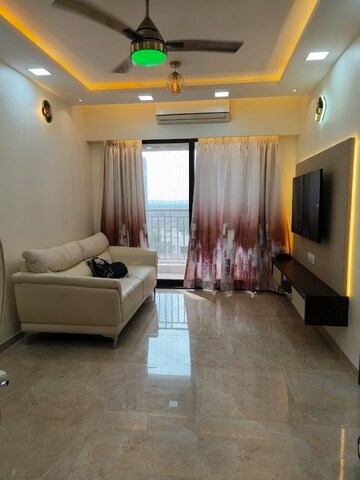 Living Room in 1 BHK Apartment at MICL Aaradhya Parkwood, Mira Road – for Rent