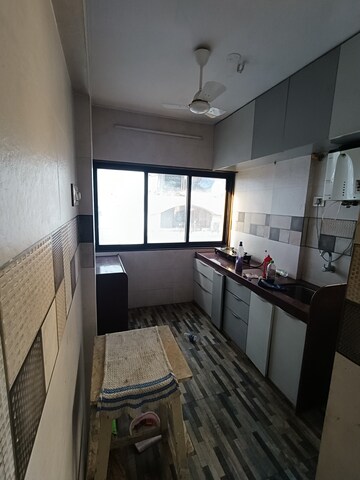 Kitchen in 3 BHK Apartment at Skylark CHS, Andheri West – for Rent