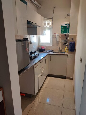 Kitchen in 1 BHK Apartment at Ajnara Daffodil, Sector 137 – for Rent