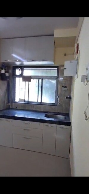 Kitchen in 2 BHK Apartment at Millie Enclave, Malad West – for Rent