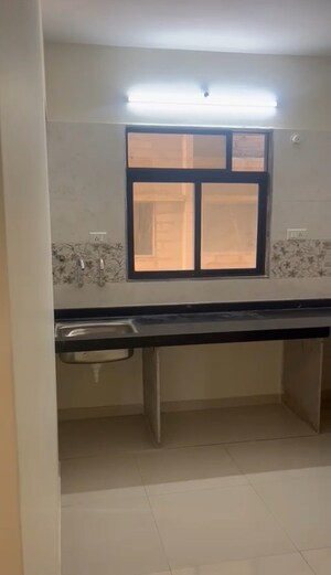 Kitchen in 1 BHK Apartment at Raj Tulsi Aawas, Badlapur East – for Sale