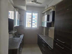 Kitchen in 3 BHK Apartment at Purvanchal Royal Park, Sector 137 – for Rent
