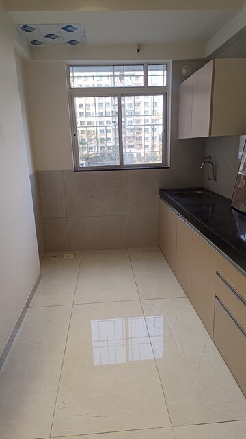 Kitchen in 1 BHK Apartment at SM Eva Homes, Chikhali – for Rent