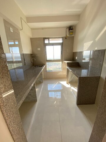 Kitchen in 2 BHK Apartment at Sheth Auris Bliss, Malad West – for Sale