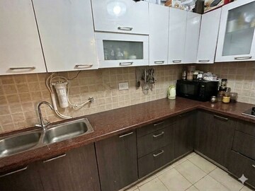 Kitchen in 3 BHK Apartment at Mahagun Moderne, Sector 78 – for Sale