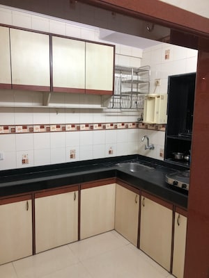 Kitchen in 1 BHK Apartment at Milap CHS, Andheri West – for Rent