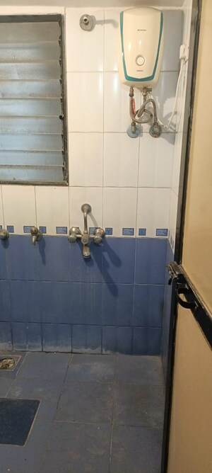 Bathroom in 1 BHK Apartment at Puranik City, Kasarvadavali – for Rent