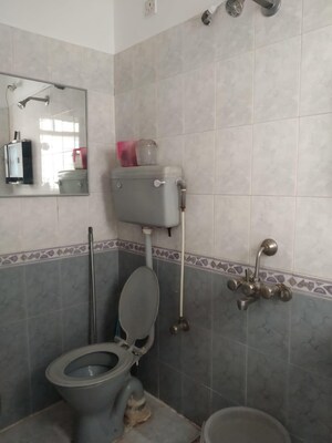Bathroom in 3 BHK Apartment at Kusum Kunj, Prabhat Road – for Rent