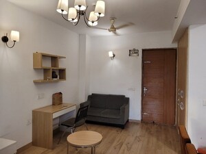 Living Room in 1 RK Apartment at Nimbus The Golden Palm, Sector 168 – for Rent