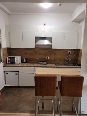 Kitchen in 1 RK Apartment at Nimbus The Golden Palm, Sector 168 – for Rent