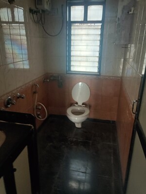 Bathroom in 3 BHK Apartment at Ratna Rajul CHS, Kandivali West – for Sale