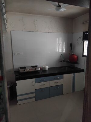 Kitchen in 3 BHK Apartment at Mantra Essence, Undri – for Rent