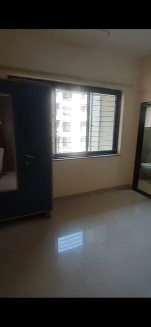 Bedroom in 2 BHK Apartment at K Raheja Palm Spring, Malad West – for Rent