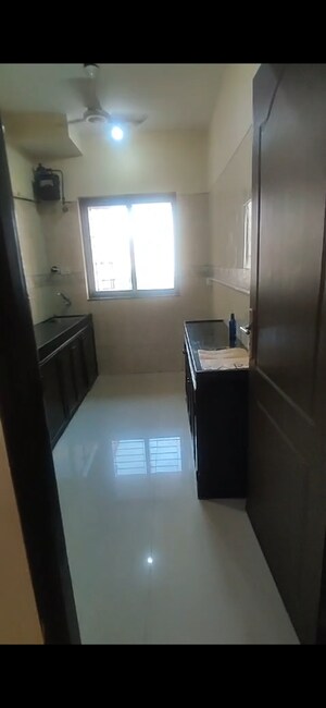 Kitchen in 2 BHK Apartment at K Raheja Palm Spring, Malad West – for Rent