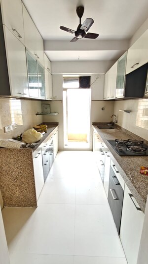 Kitchen in 2 BHK Apartment at Om Heights Malad, Malad East – for Rent