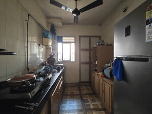 Kitchen in 2 BHK Apartment at Vijay Nagari Annex, Waghbil – for Sale