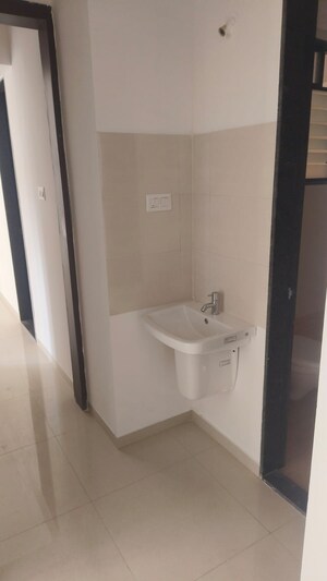 Bathroom in 2 BHK Apartment at Royal Ishana, Thergaon – for Rent