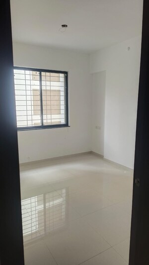 Room in 2 BHK Apartment at Royal Ishana, Thergaon – for Rent