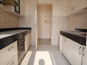 Kitchen in 2.5 BHK Apartment at Mahindra Aura, Sector 110a – for Rent