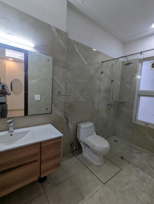 Bathroom in 3 BHK Apartment at Tata Raheja Raisina Residency, Sector 59 – for Sale
