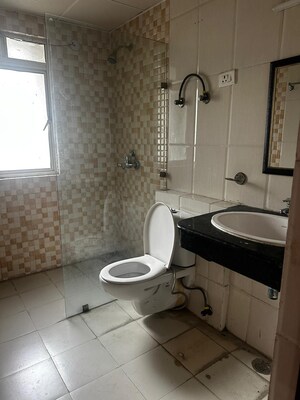 Bathroom in 2.5 BHK Apartment at Nimbus The Golden Palm, Sector 168 – for Rent