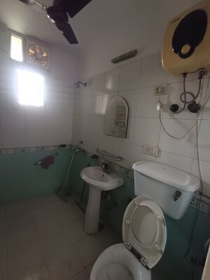 Bathroom in 2 BHK Apartment at Mahagun Mansion I and II, Vaibhav Khand – for Rent