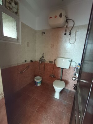 Bathroom in 2 BHK Apartment at Mahagun Mansion I and II, Vaibhav Khand – for Rent