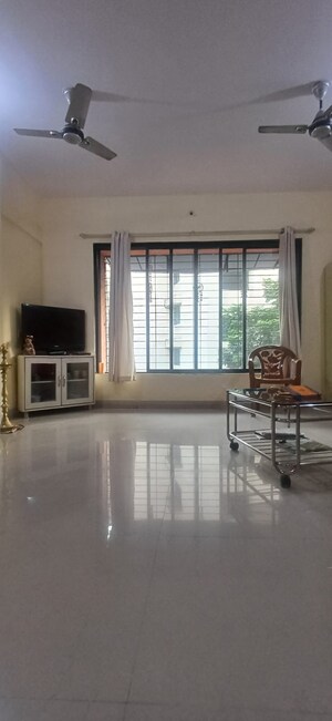 Living Room in 2 BHK Apartment at Nav Durga CHS, Naupada – for Sale