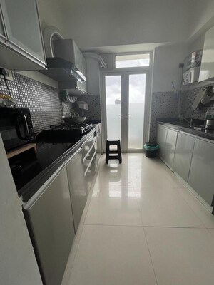 Kitchen in 2 BHK Apartment at Omkar Alta Monte, Malad East – for Rent