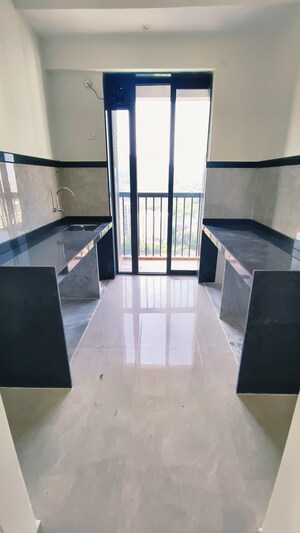 Kitchen in 2 BHK Apartment at Damji Shamji Mahavir Spring Tulip Phase 1, Pokhran Road No Two – for Rent