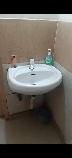 Bathroom in 2 BHK Apartment at Raj Nagar Extension – for Sale