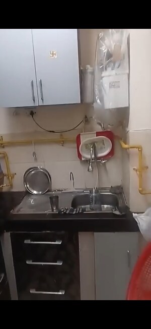 Kitchen in 2 BHK Apartment at Raj Nagar Extension – for Sale