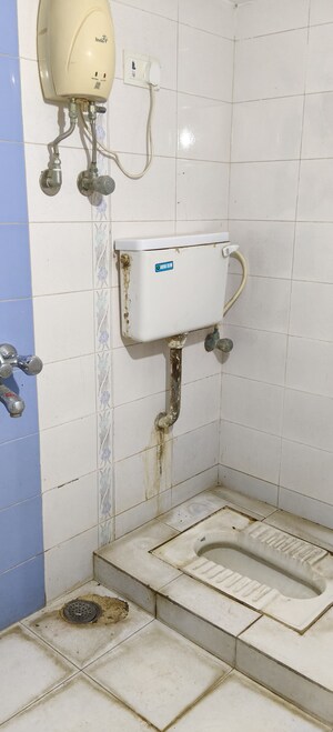 Bathroom in 1 BHK Apartment at Nav Joytiling CHS, Goregaon East – for Rent