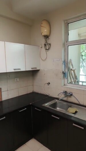 Kitchen in 3 BHK Apartment at Ansal API Esencia, Sector 67 – for Rent
