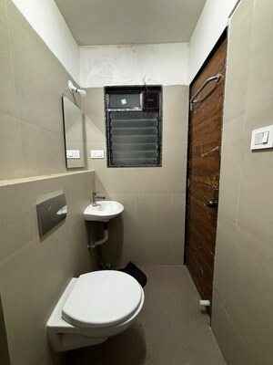Bathroom in 2 BHK Apartment at Je And Vee Om Trimurti, Malad East – for Rent