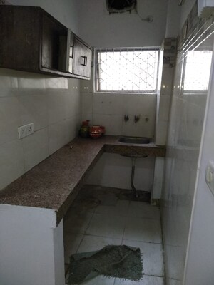 Kitchen in 1.5 BHK Builder Floor at Amar Colony – for Rent