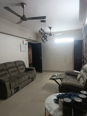 Living Room in 2.5 BHK Apartment at Aims Golf City, Sector 75 – for Rent